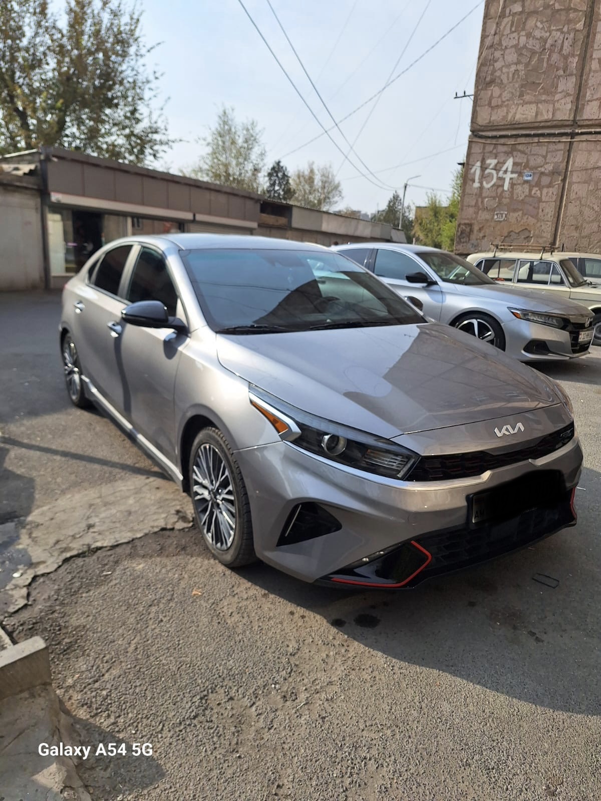 Kia Forte GT Line 2023 with driver in Armenia